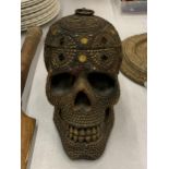 A LARGE ORNATE TWO PIECE SKULL CONTAINER