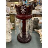 A LARGE CRANBERRY GLASS CANDLE HOLDER WITH HANDPAINTED DECORATION AND CRYSTAL DROPLETS, HEIGHT 31CM