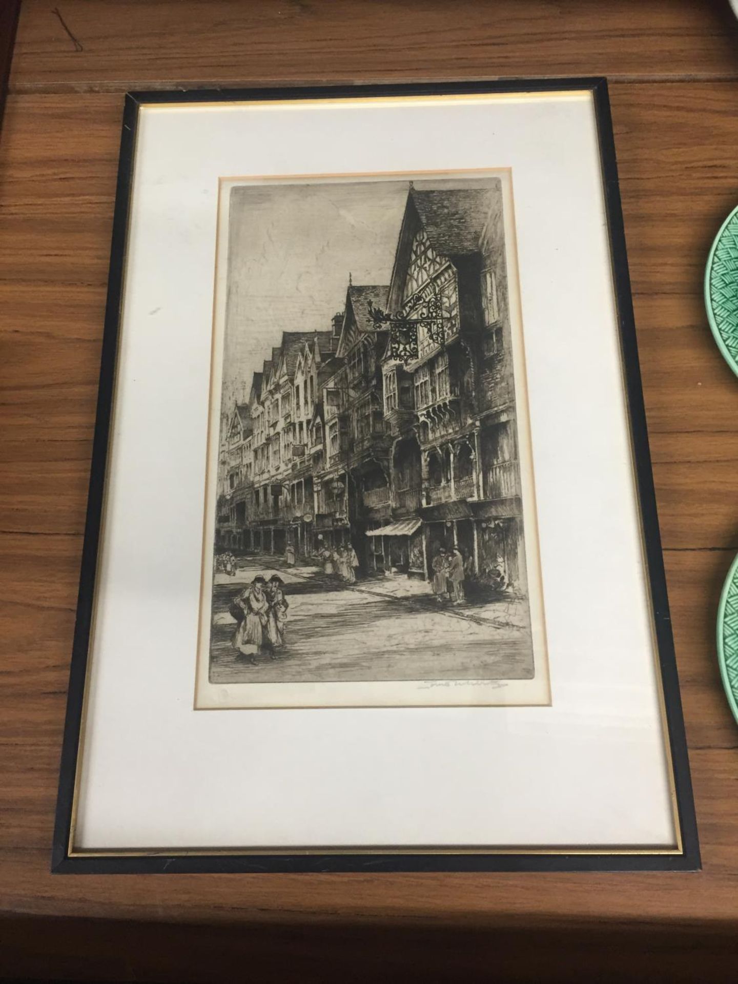 A FRAMED PRINT OF A VINTAGE STREET SCENE, SIGNED IN PENCIL