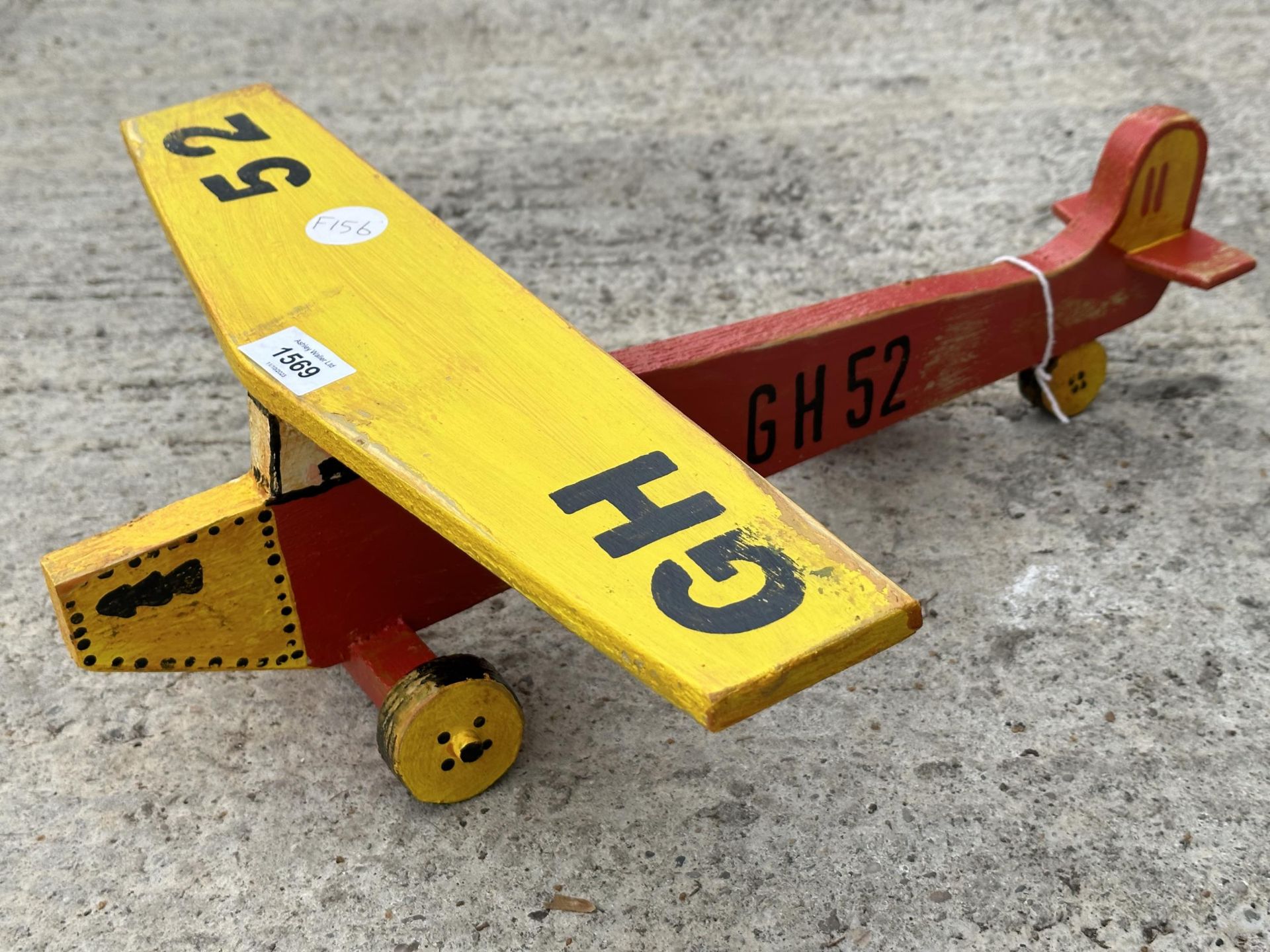 A SCRATCH BUILT WOODEN HAND PAINTED PLANE