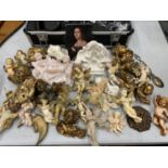 A LARGE COLLECTION OF WALL HANGING CHERUBS IN CREAM AND GILT COLOURS