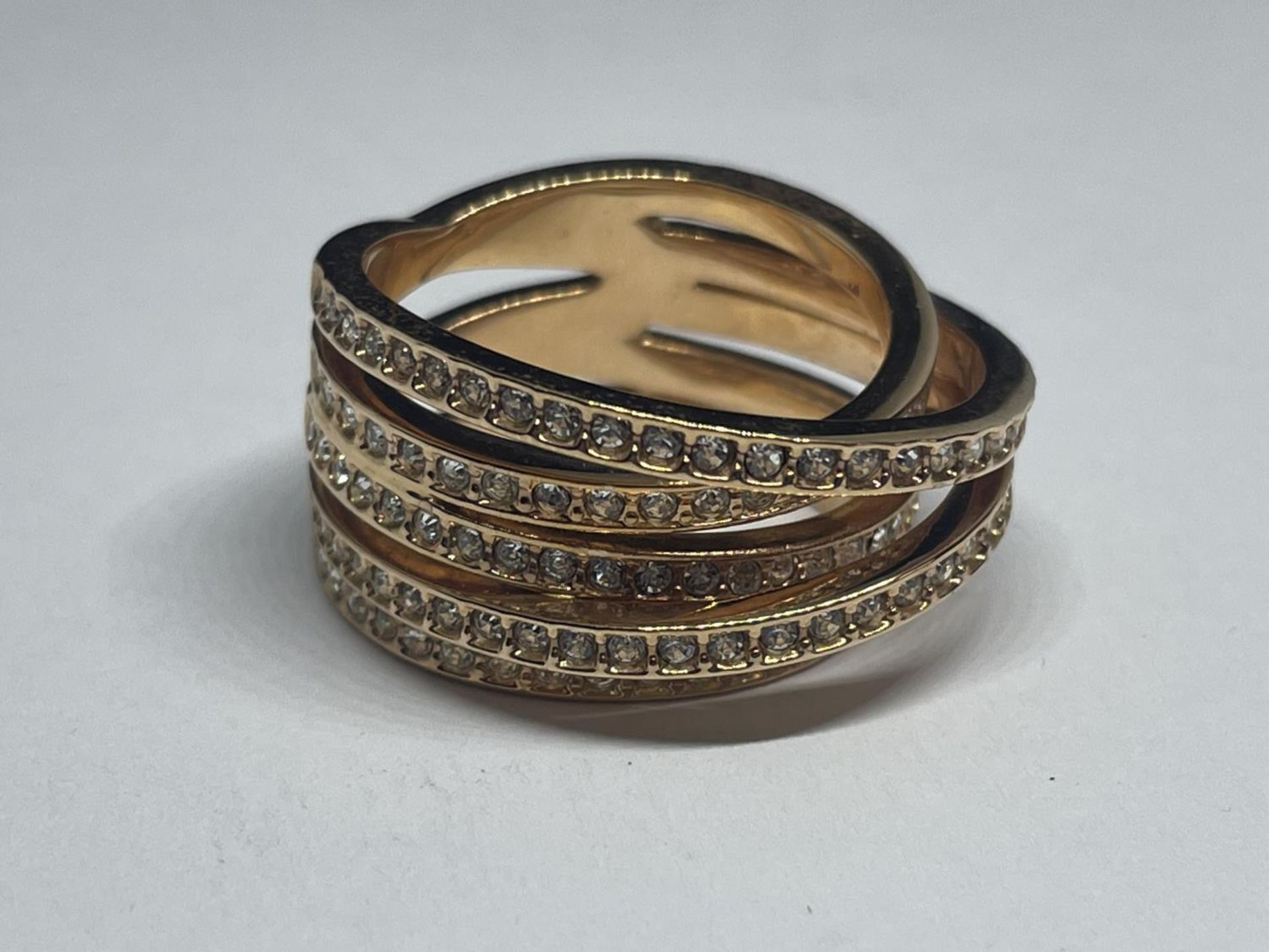 A SWAROVSKI CRYSTAL RING WITH LABEL, PRESENTATION BOX AND SLEEVE SIZE Q