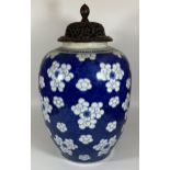A LARGE 19TH CENTURY CHINESE BLUE AND WHITE PRUNUS BLOSSOM GINGER JAR WITH CARVED WOODEN LID, DOUBLE