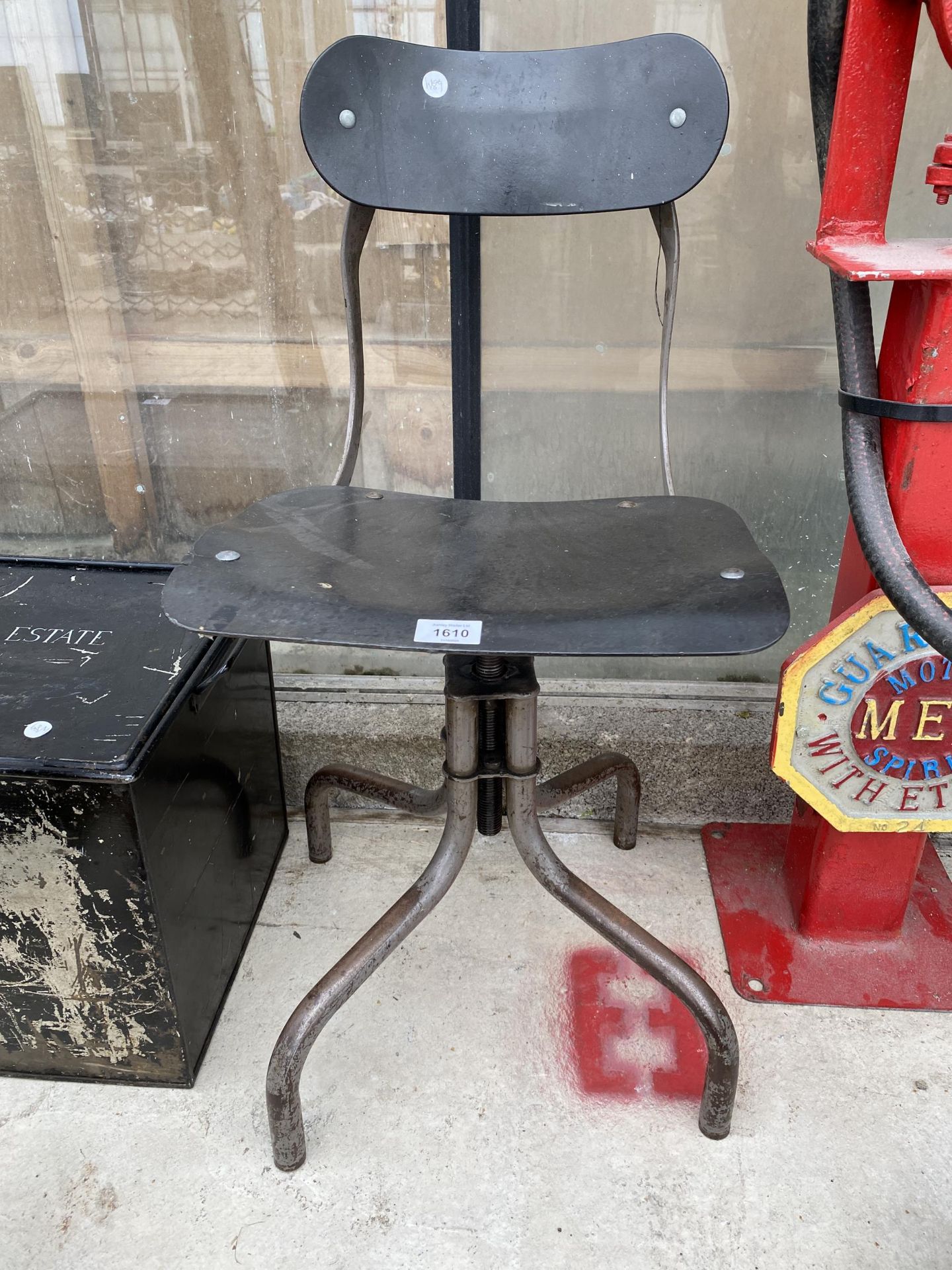 AN INDUSTRIAL ADJUSTABLE MACHINIST CHAIR