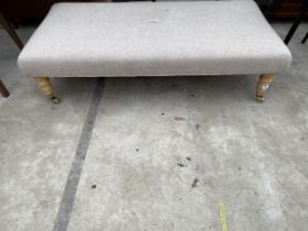 A VICTORIAN STYLE STOOL ON TURNED LEGS WITH BRASS CASTERS, 45 X 23"