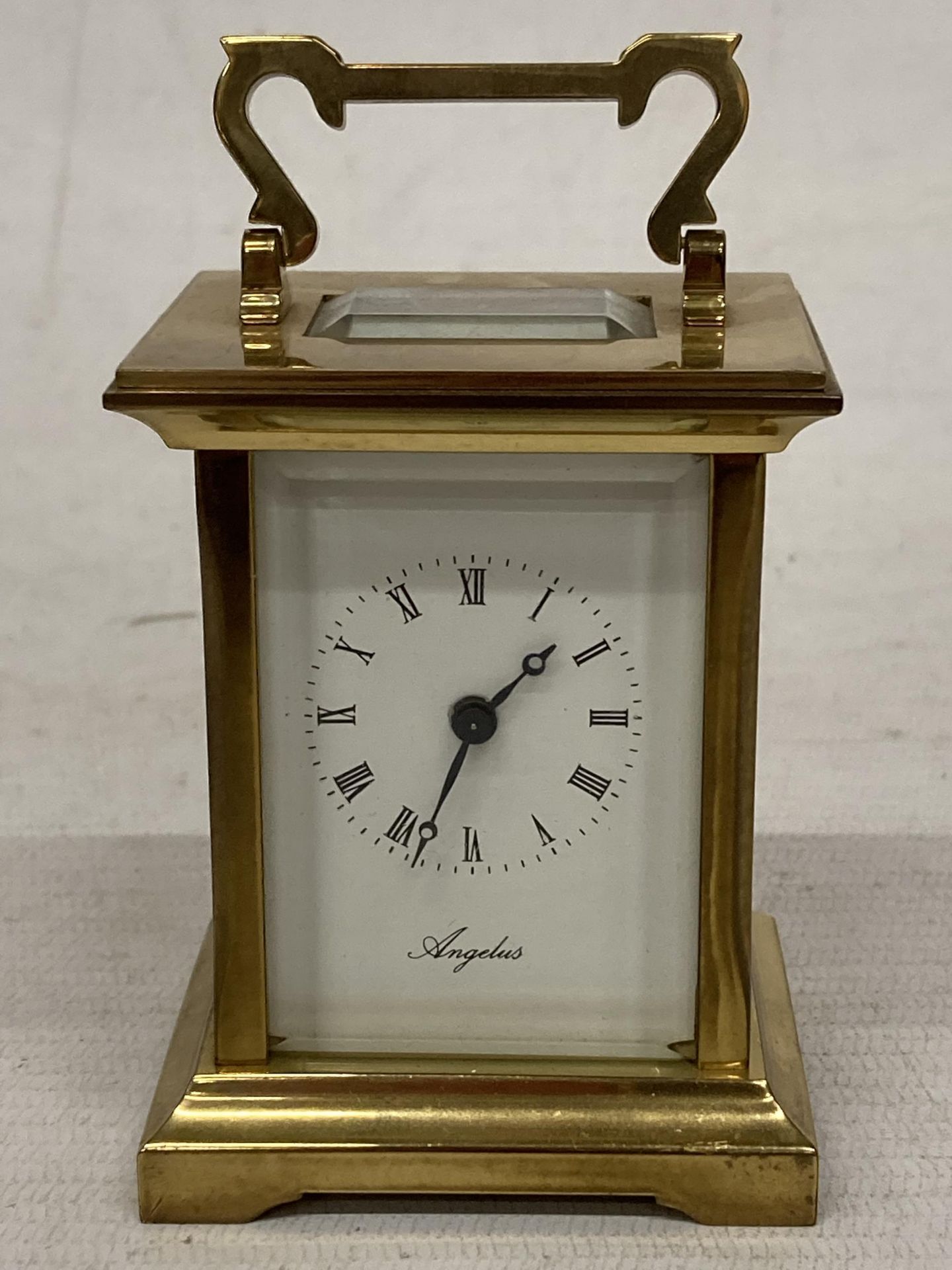 A VINTAGE ANGELUS FRENCH BRASS CASED CARRIAGE CLOCK