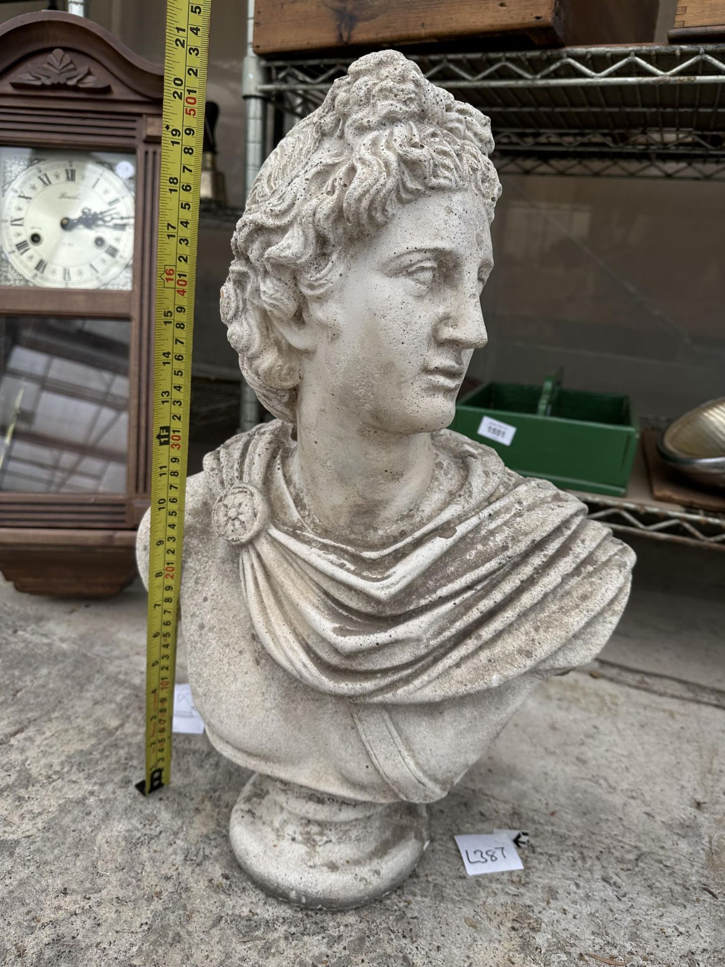 A RECONSTITUTED STONE GARDEN BUST OF A MALE