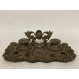 A VINTAGE, POSSIBLY FRENCH, FLORAL DESIGN BRASS DOUBLE INKWELL STAND