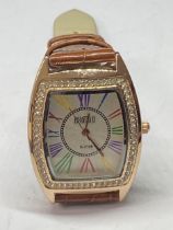 A WRIST WATCH SEEN IN WORKING ORDER BUT NO WARRANTY