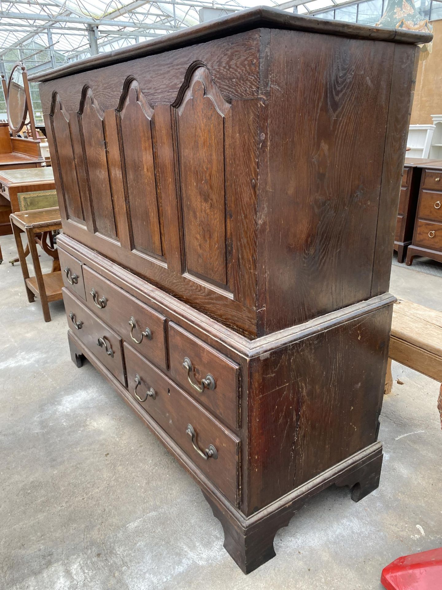 A GEORGIAN OAK FOUR PANEL MULE CHEST WITH FIVE DRAWERS TO THE BASE, 52" WIDE, ON BRACKET FEET - Image 2 of 7