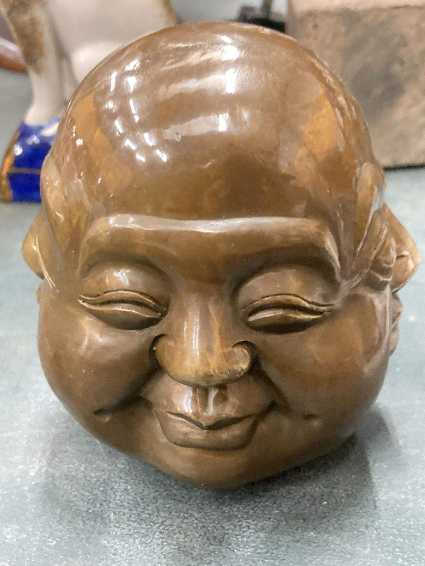 A HEAVY BRASS FOUR FACED BUDDAH, HEIGHT 12CM