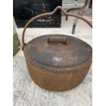 A VINTAGE CAST IRON ROMANY POT BELLY COOKING POT COMPLETE WITH LID