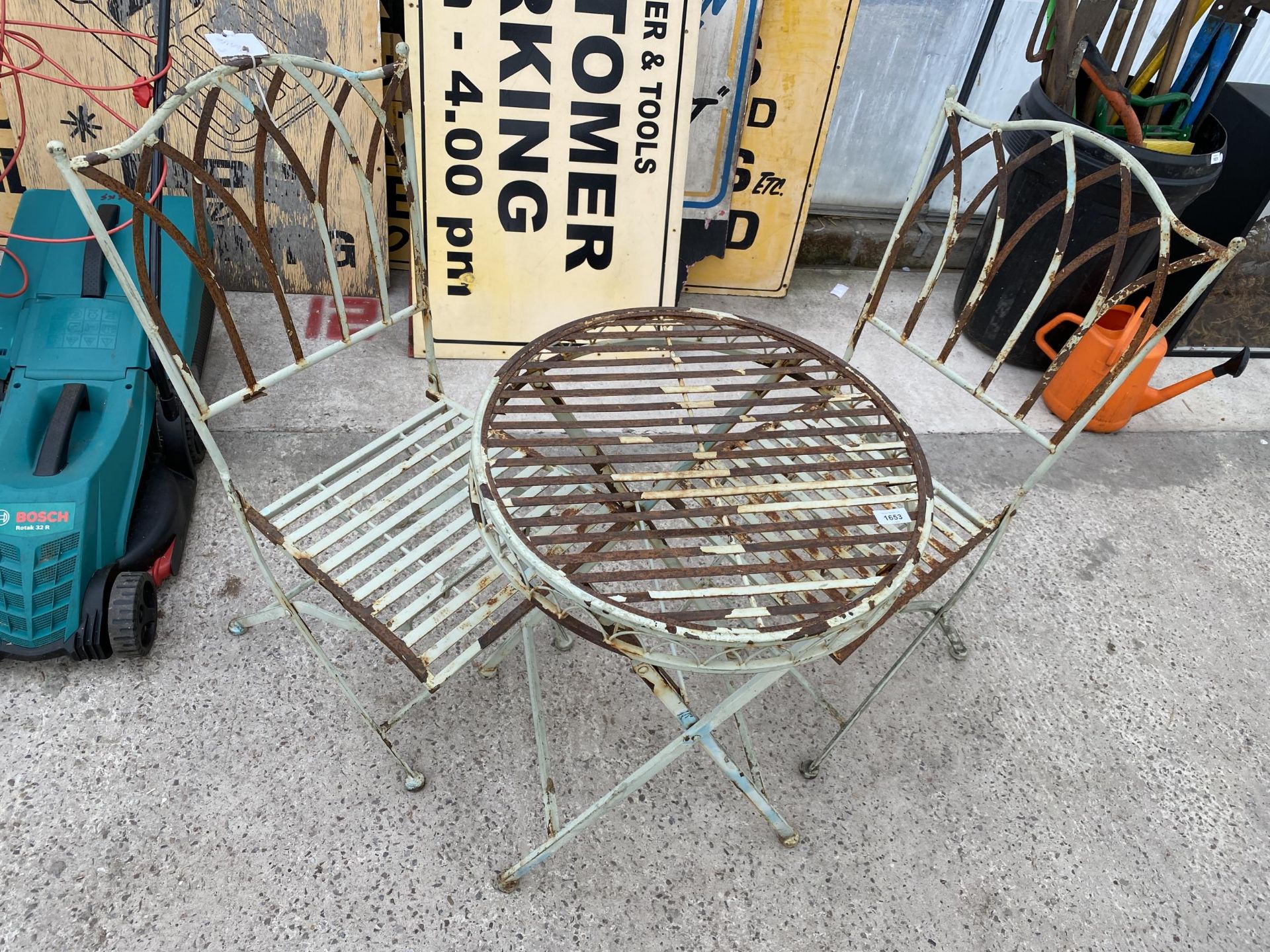 A METAL FOLDING BISTRO SET COMPRISING OF A ROUND TABLE AND TWO CHAIRS