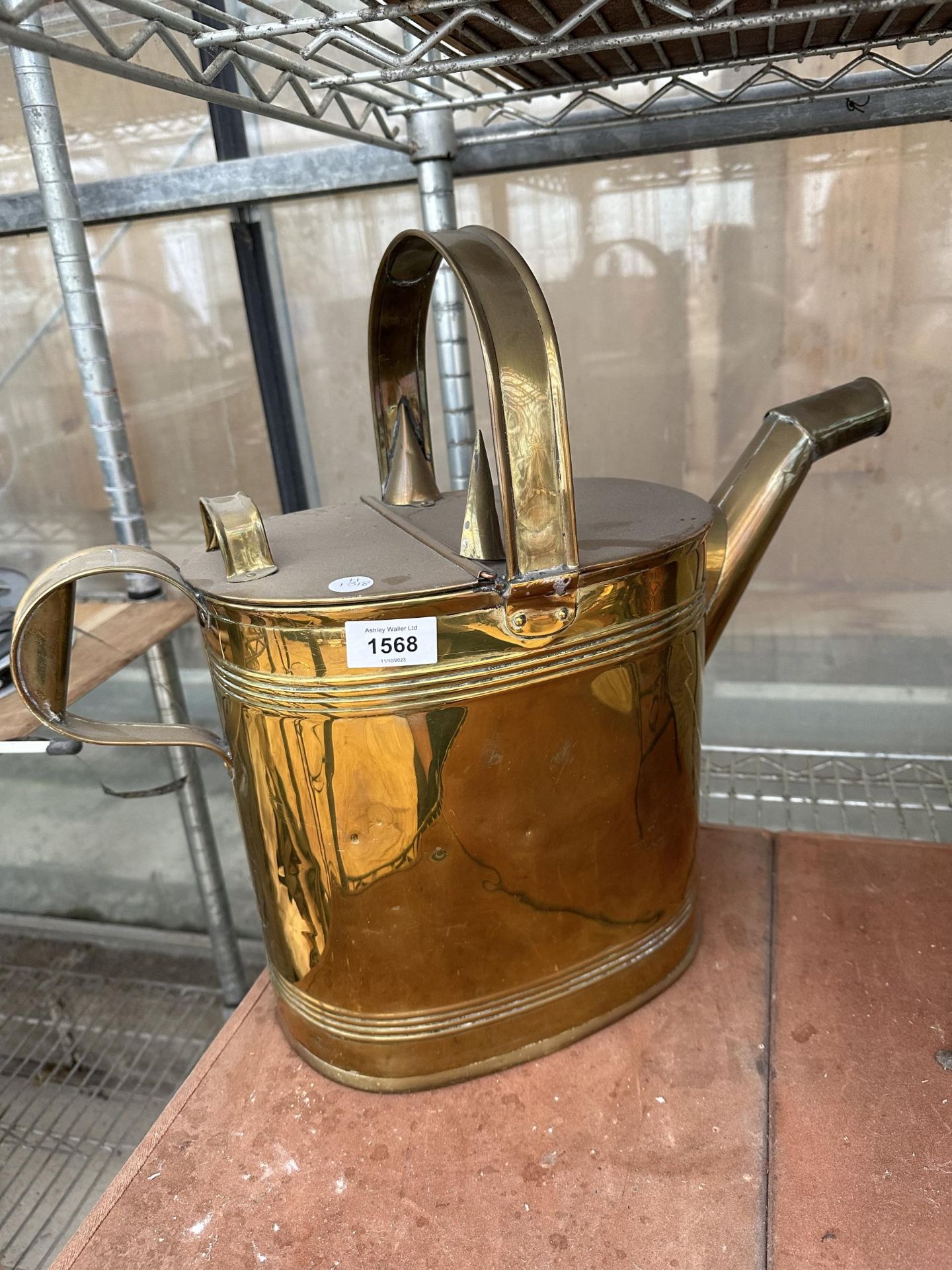 A VINTAGE BRASS WATERING CAN