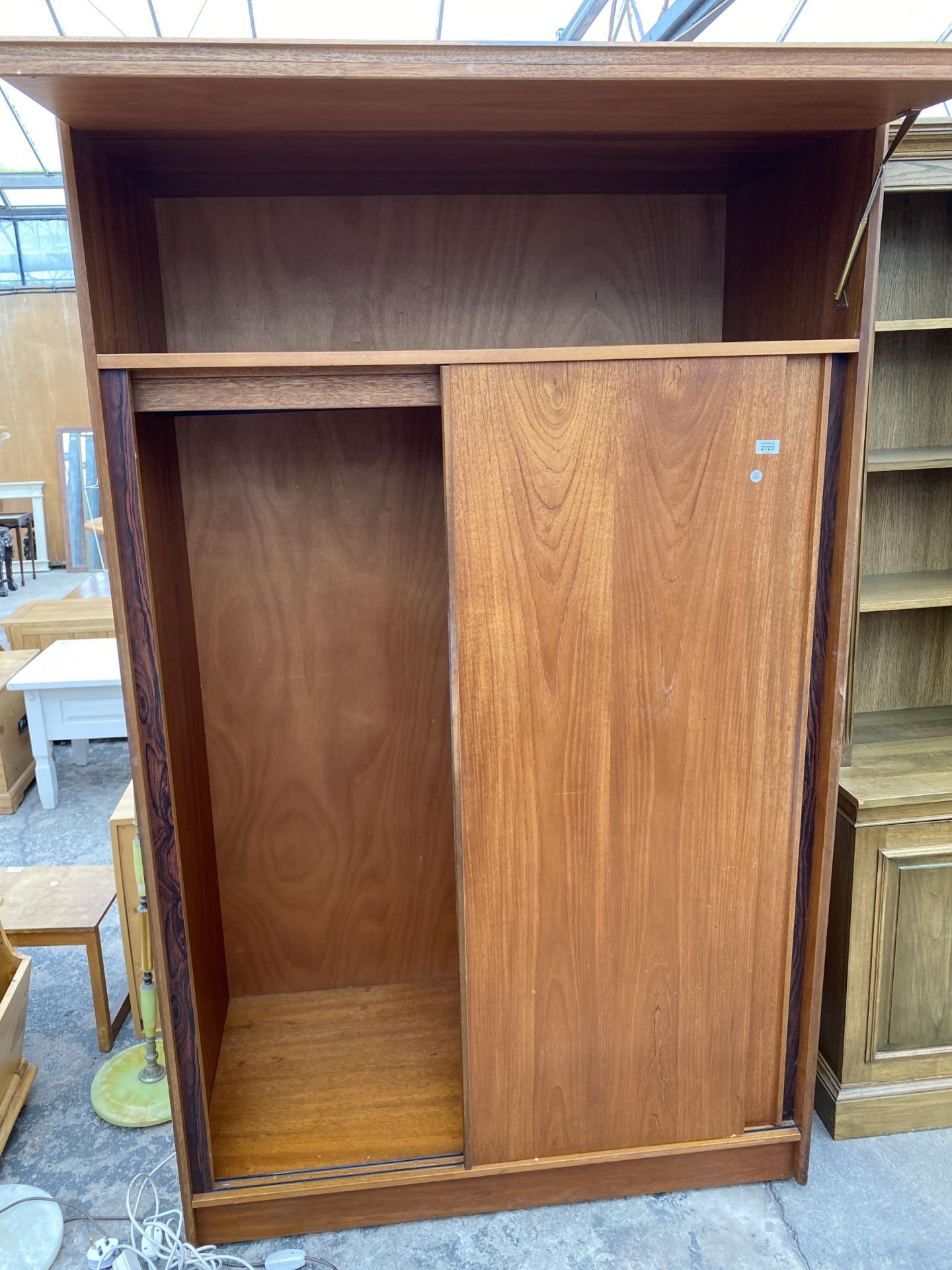 A RETRO TEAK AUSTINSUITE SLIDING TWO DOOR WARDROBE WITH TOP STORAGE SECTION, 48" WIDE, ON CASTERS - Image 3 of 5