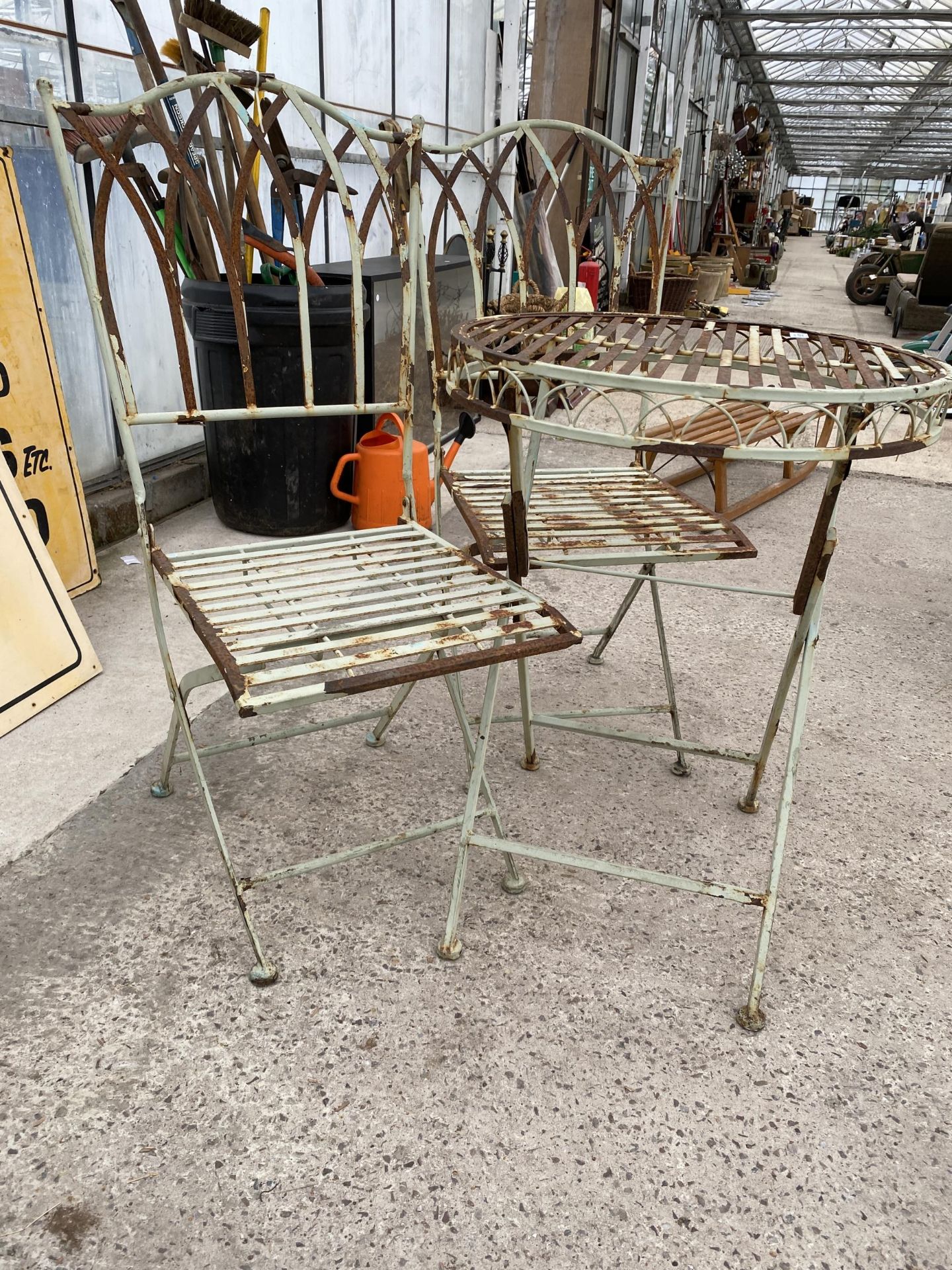 A METAL FOLDING BISTRO SET COMPRISING OF A ROUND TABLE AND TWO CHAIRS - Image 2 of 3