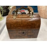 A VINTAGE WALNUT DOMED JEWELLERY BOX WITH BRASS HANDLE