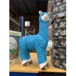 A LARGE TURQUOISE MODEL OF A LLAMA, HEIGHT 58CM