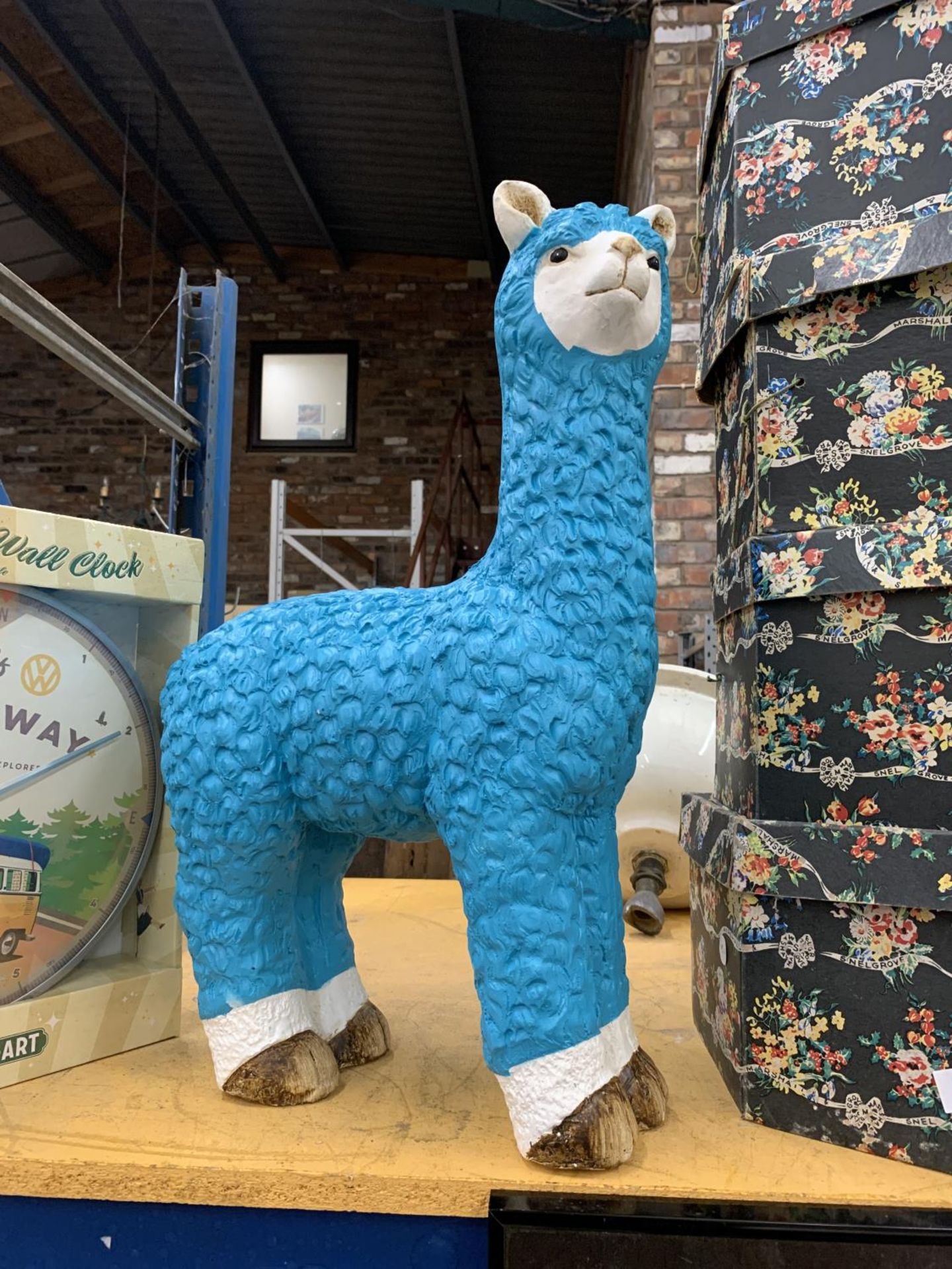 A LARGE TURQUOISE MODEL OF A LLAMA, HEIGHT 58CM