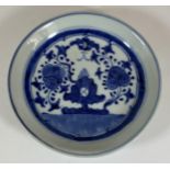 A 19TH CENTURY QING CHINESE BLUE AND WHITE PORCELAIN DISH WITH UNUSUAL FLORAL DESIGN, FLOWER MARK TO