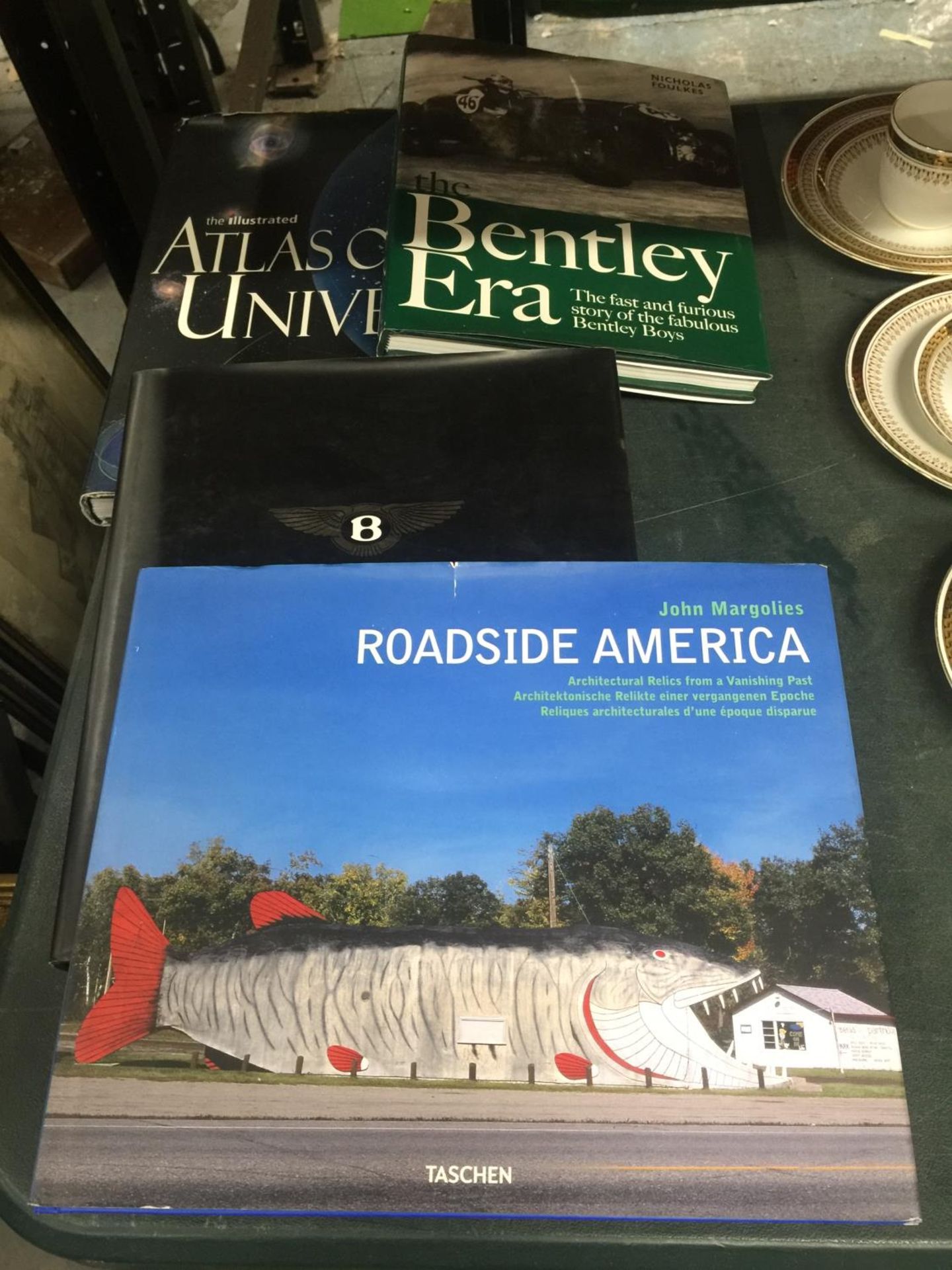 TWO HARDBACK BENTLEY BOOKS, AN ATLAS OF THE UNIVERSE PLUS ROADSIDE AMERICA