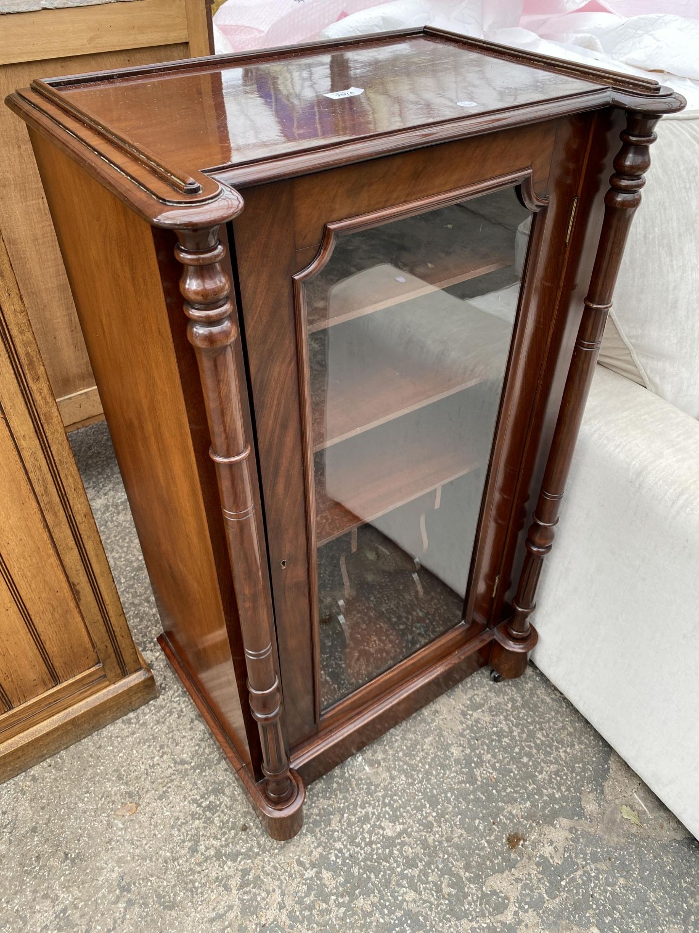 A VICTORIAN STYLE MAHOGANY MUSIC CABINET WITH GLASS DOOR