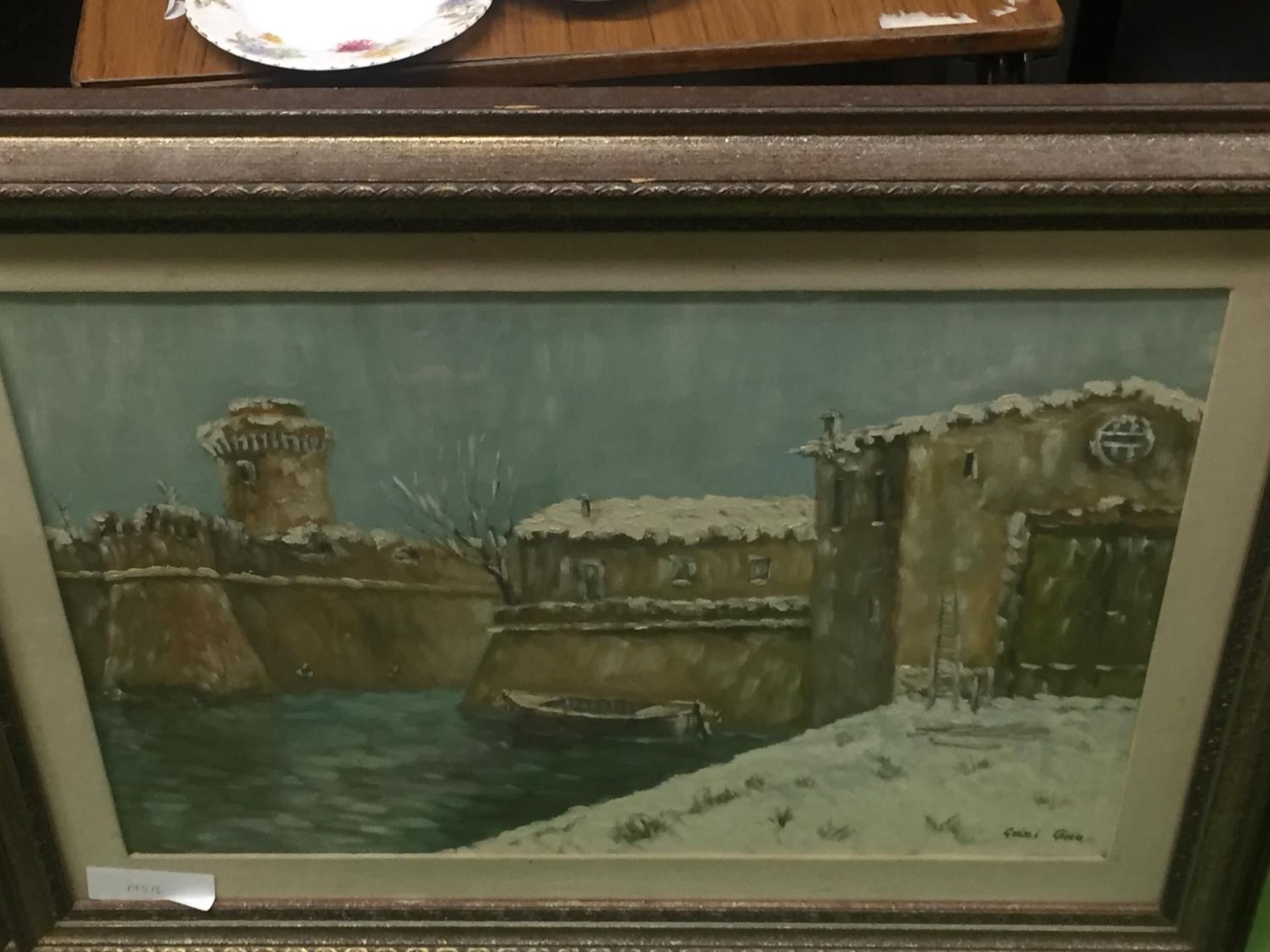 A LARGE SIGNED GUIDI GINO OIL ON CANVAS PAINTING OF CASTLE WALLS AND A MOAT, FRAMED, 91CM X 72CM