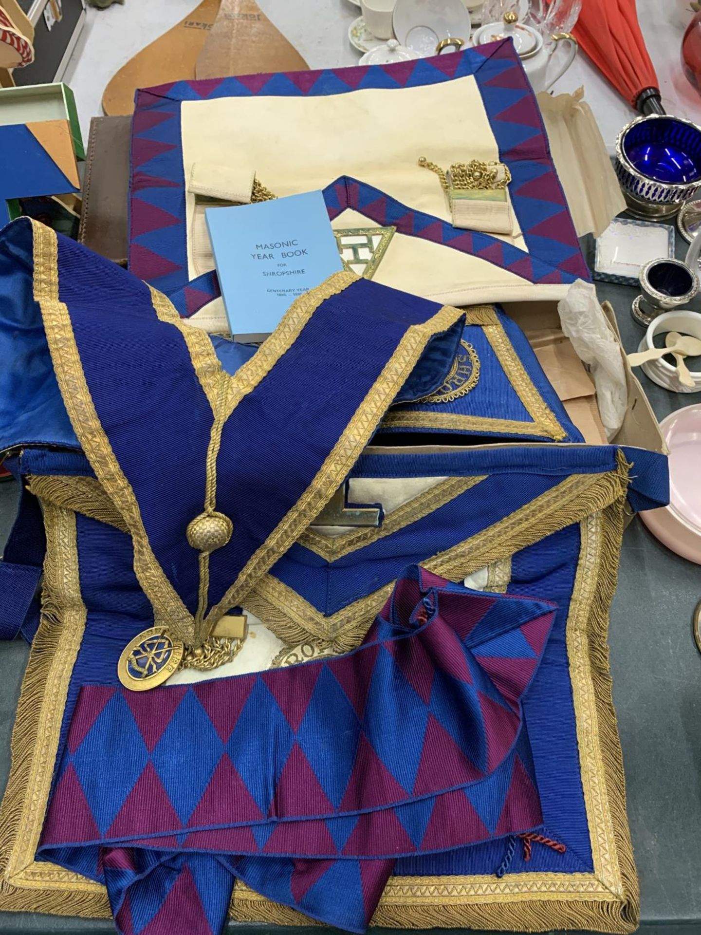 A COLLECTION OF MASONIC ITEMS FROM SHROPSHIRE LODGE TO INCLUDE A PENANT, SASH, AMULETS, YEAR BOOK,