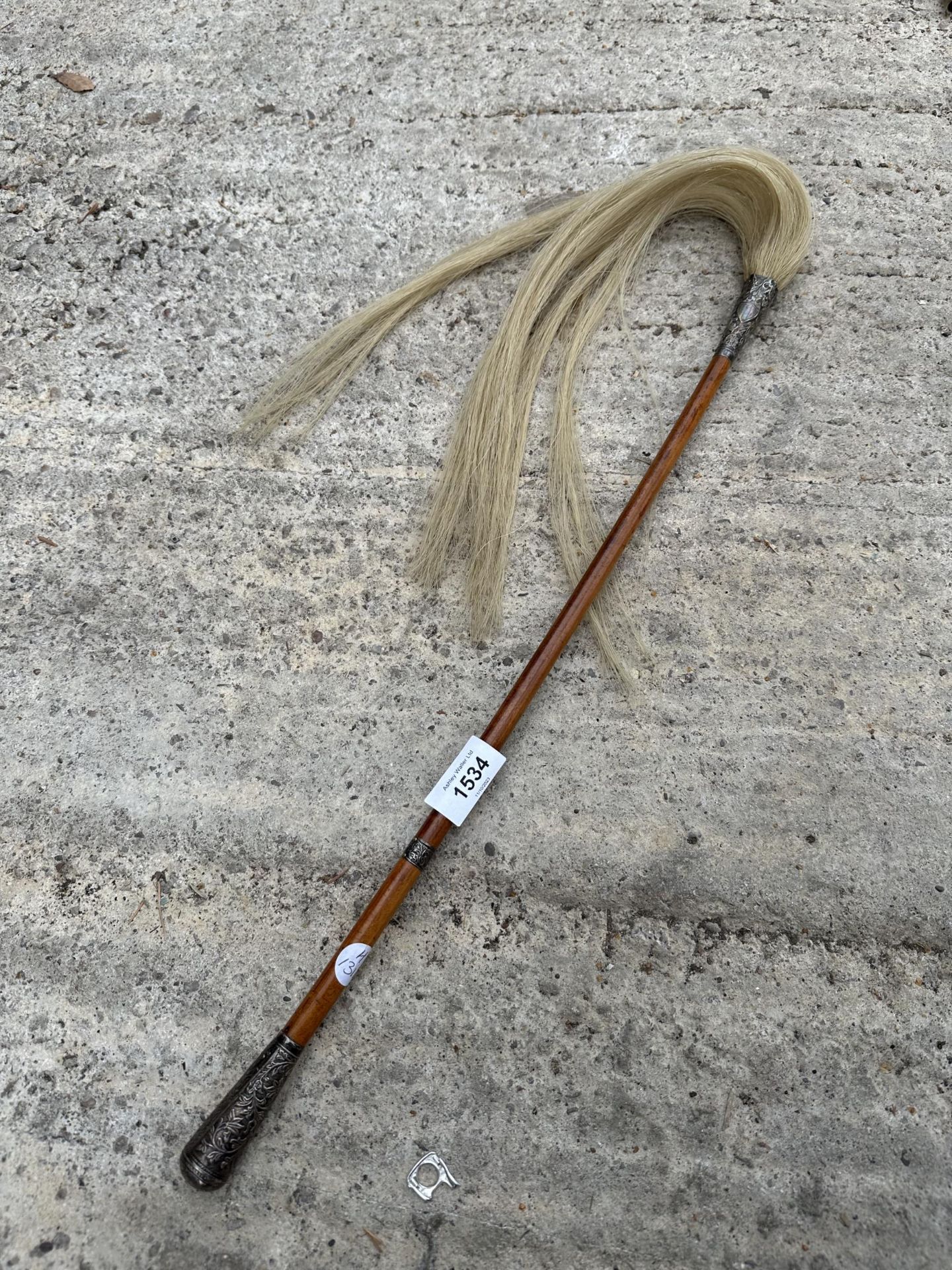 A VINTAGE INDIAN HORSE HAIR FLY WHISK SWAT WITH BELIEVED INDIAN SILVER COLLARS AND FERIAL
