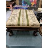 A VINTAGE MAHOGANY FOOTSTOOL WITH SCROLL FEET