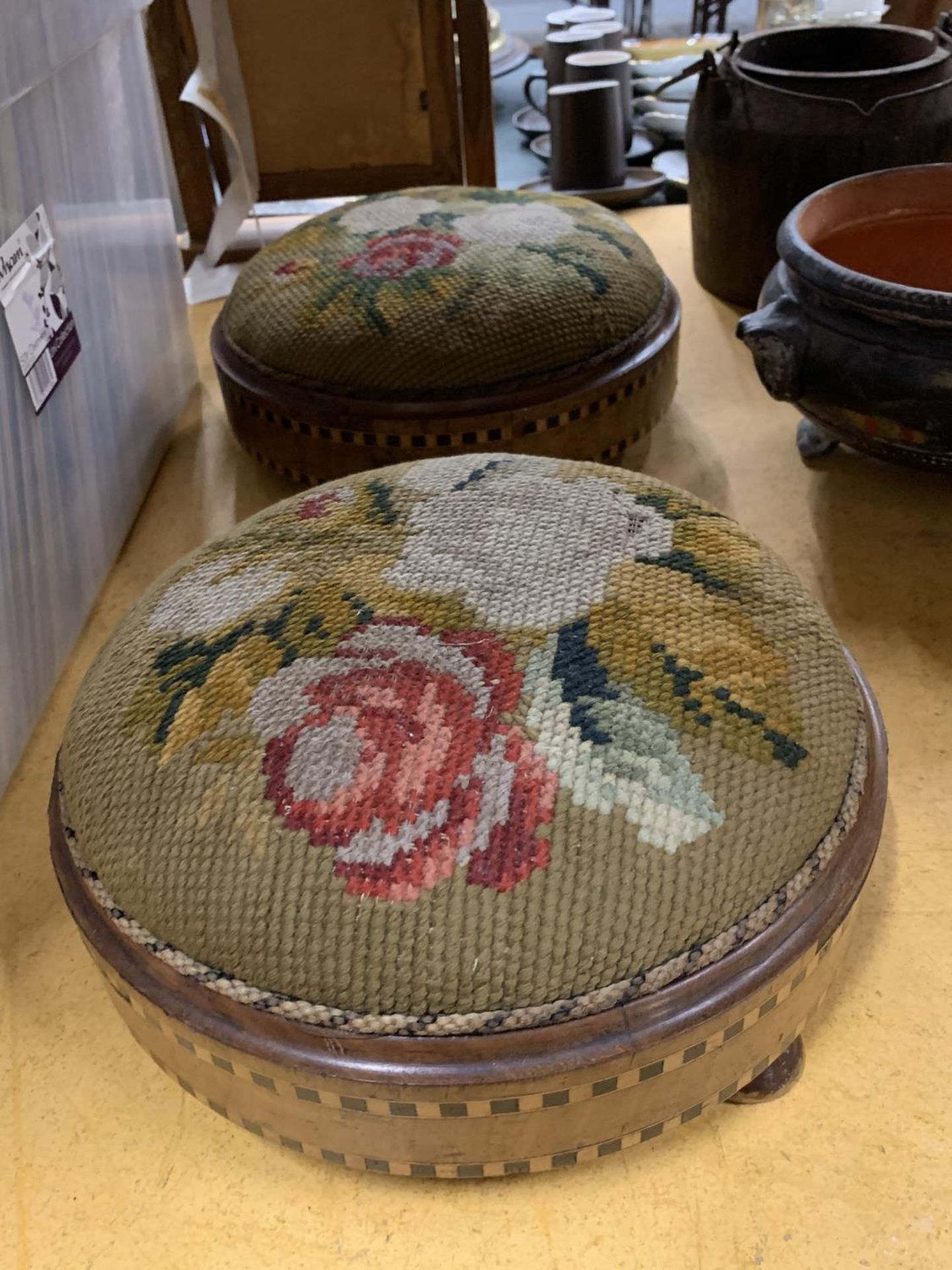 TWO VINTAGE FOOTSTOOLS WITH INLAID BANDING AND TAPESTRY TOPS