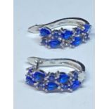 A PAIR OF BLUE STONE EARRINGS