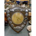 A 1970'S WOODEN SHIELD FOR NORTH STAFFS. R.C.C. WITH AN IMAGE OF A CANARY TO THE MIDDLE, HEIGHT 45CM