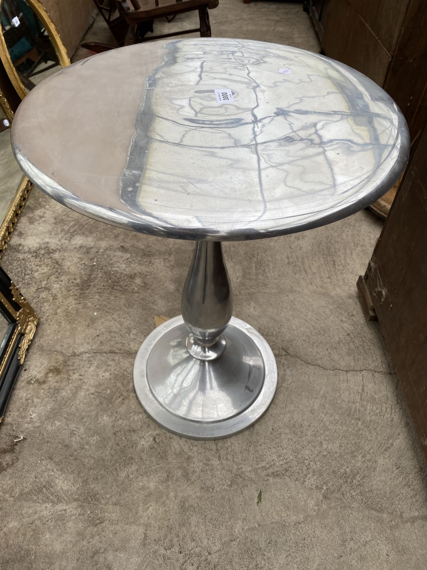 A POLISHED ALLOY 19" DIAMETER WINE TABLE ON PEDESTAL