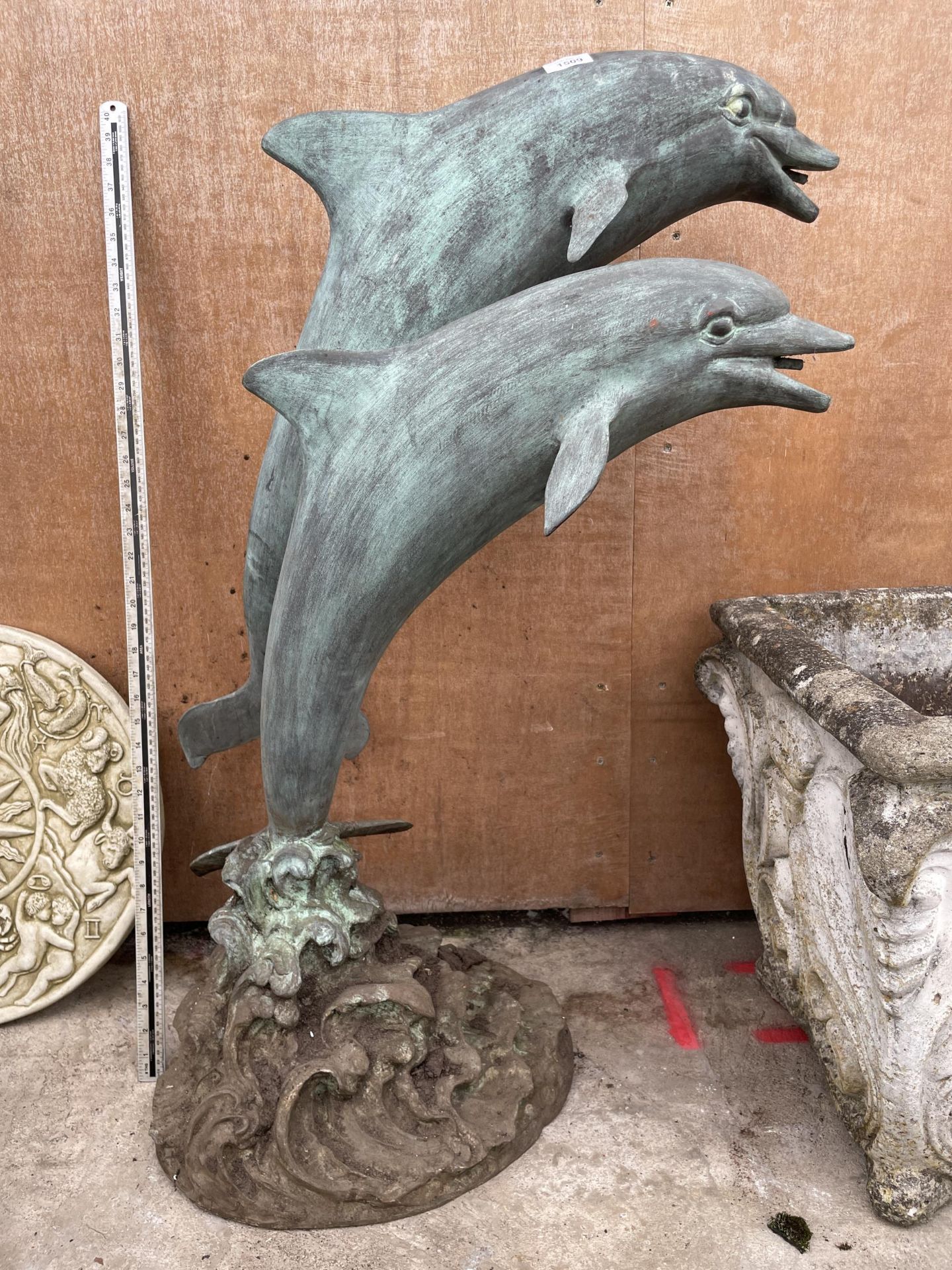 A BRONZE GARDEN WATER FEATURE FIGURE OF A PAIR OF JUMPING DOLPHINS (H:97CM)
