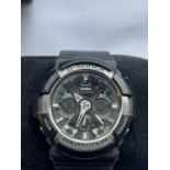 A CASIO G SHOCK WRIST WATCH SEEN WORKING BUT NO WARRANTY