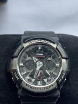 A CASIO G SHOCK WRIST WATCH SEEN WORKING BUT NO WARRANTY