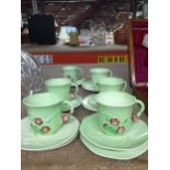 SIX CARLTON WARE LEAF PATTERN CUPS AND SAUCERS