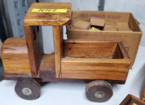 A VINTAGE WOODEN TRUCK MODEL AND WOODEN BLOCKS