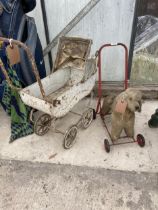 A VINTAGE DOLLS PRAM AND A PUSH ALONG DOG