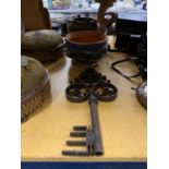 A VERY HEAVY CAST GLUE/COOKING POT, A BLACK CERAMIC PLANTER PLUS A LARGE METAL KEY