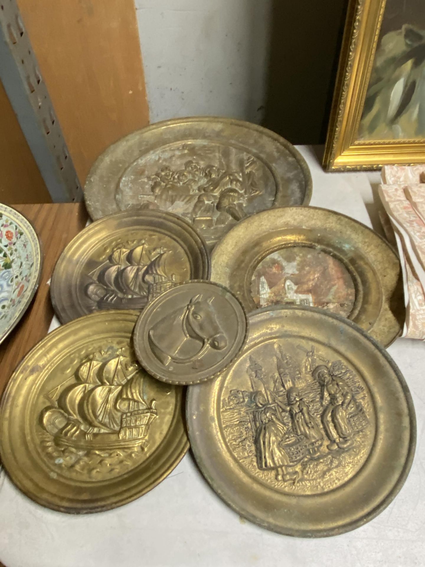 A GROUP OF VINTAGE BRASS PLATES