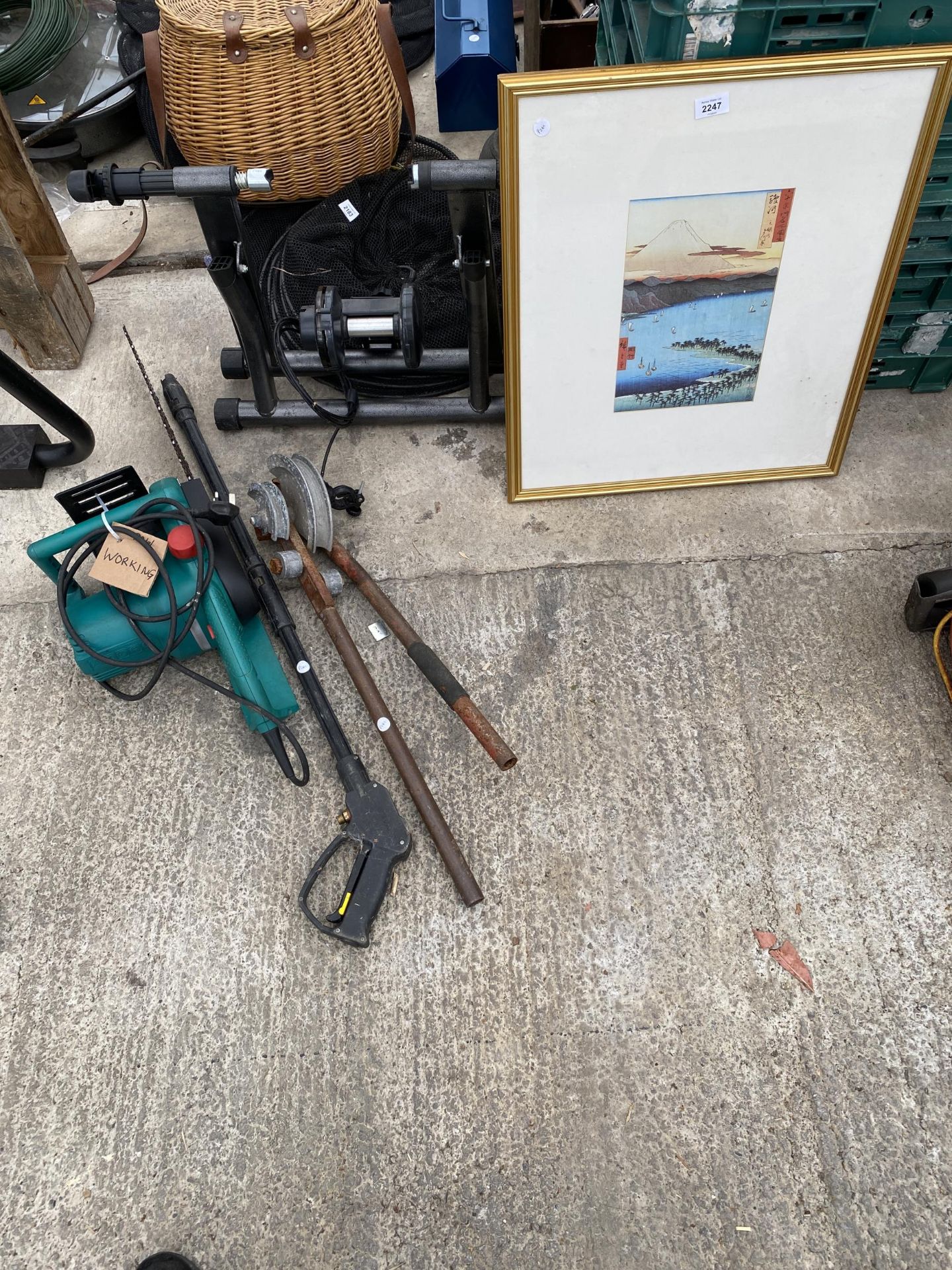 AN ASSORTMENT OF ITEMS TO INCLUDE PIPE BENDER, ELECTRIC CHAINSAWAND A BIKE STAND ETC