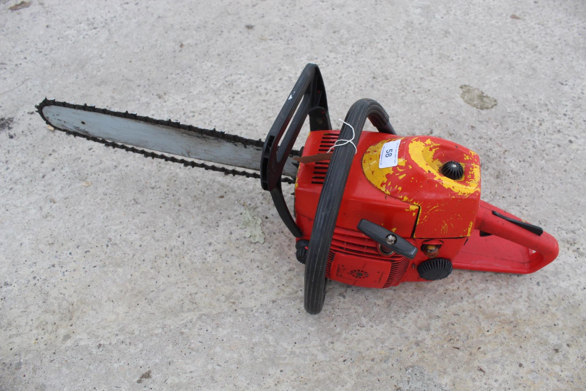 A RED PETROL CHAINSAW-NO VAT