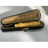 A CASED CHEROOT HOLDER