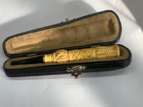 A CASED CHEROOT HOLDER