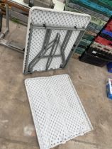 A FOLDING PLASTIC TRESTLE TABLE