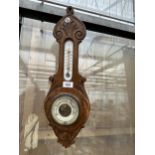 AN OAK CASED BAROMETER