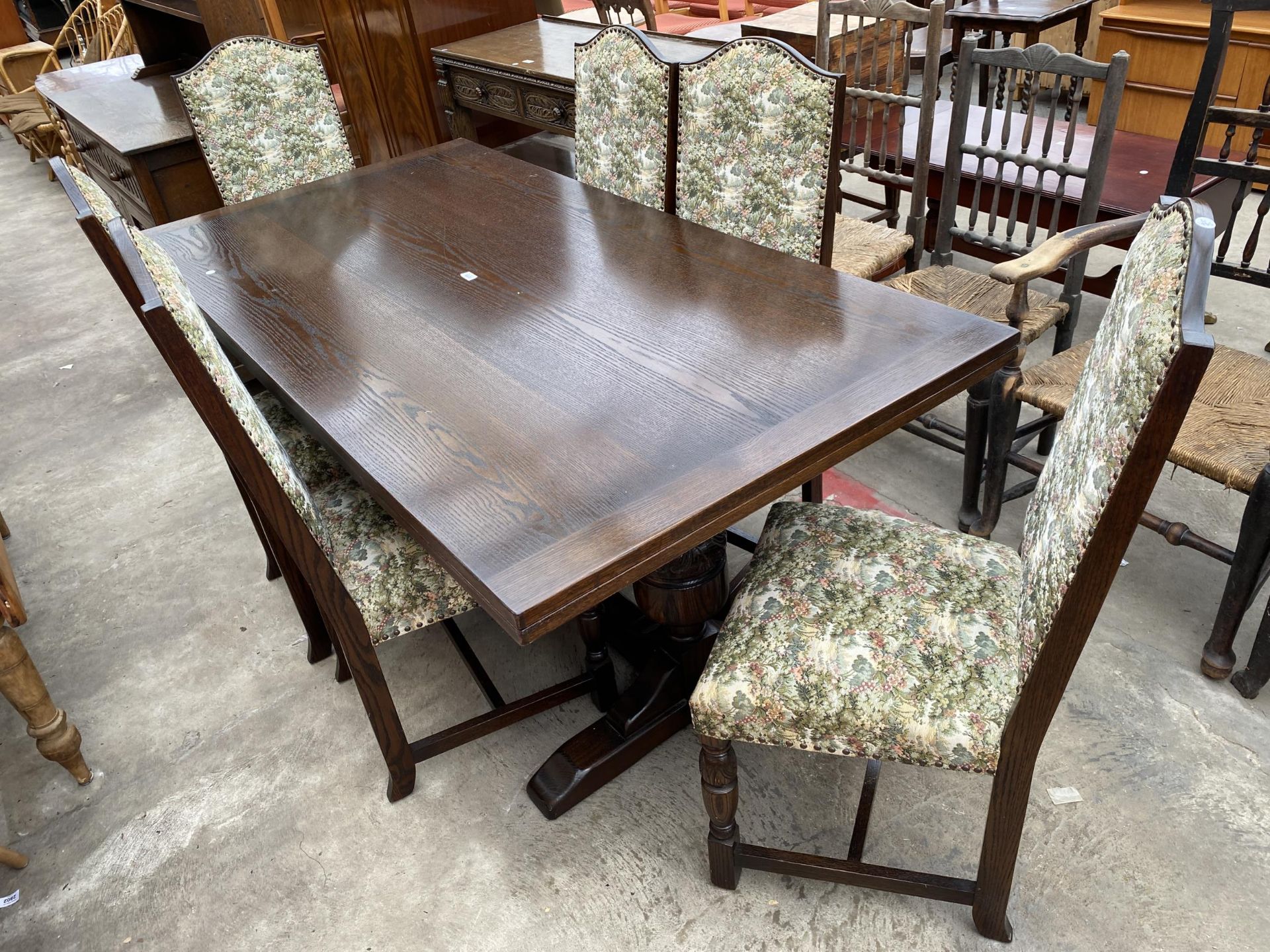 AN OAK JACOBEAN STYLE TWIN-PEDESTAL DRAW-LEAF DINING TABLE, 72 X 36" (LEAVES 18" EACH)