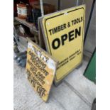 A 'TIMBER AND TOOLS' WOODEN A BOARD SIGN AND A FURTHER WOODEN SIGN